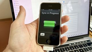 An original iPhone syncing content with Finder