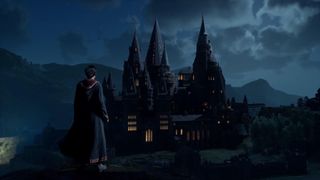 Hogwarts Legacy - a student in wizard robes looks out over Hogwarts from above at night