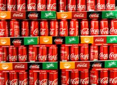 A photo of cans of Coca-Cola soft drinks