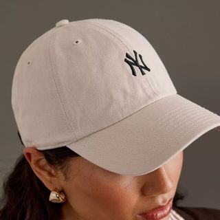 Image of woman wearing baseball cap