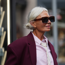 Grece Ghanem wears short platinum blonde bob with burgundy blazer