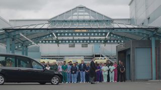 The Holby staff turn out in force to pay tribute as Duffy's hearse passes the ED