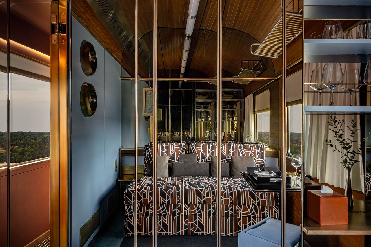 A 1980s-inspired luxury train features sleek decor.