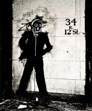 Street art of man with skull face