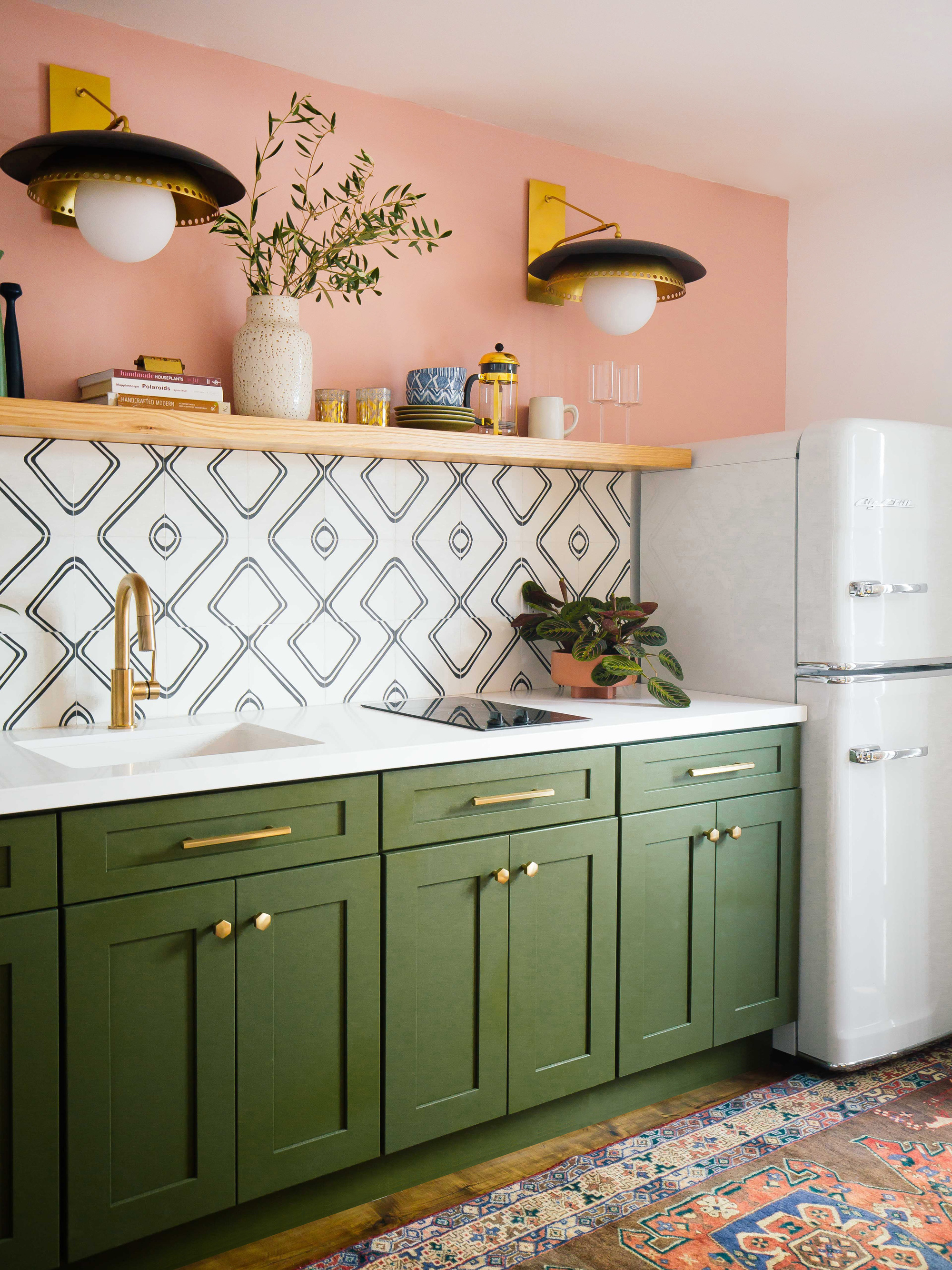 Olive green cabinets paired with a light pink