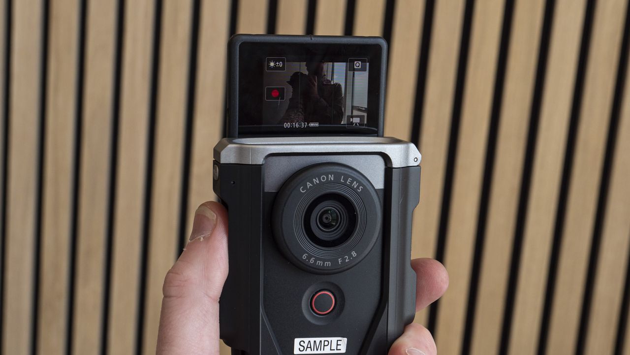 Canon Powershot V10 in the hand with screen up