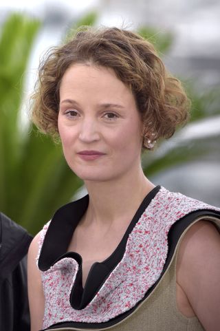 A woman with short hair cut in a bixie cut.