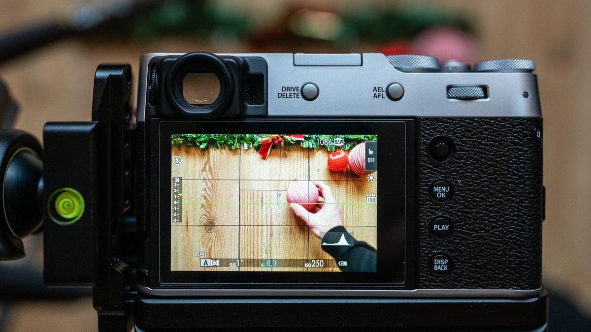 A camera photographing a flat lay scene