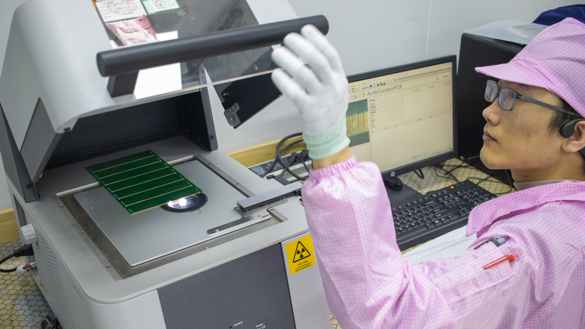 An engineer at work in the Failure Analysis lab