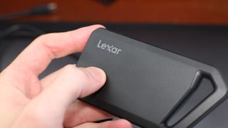 Lexar Professional SL600 SSD close up of logo held in a hand