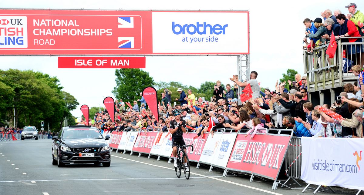 Peter Kennaugh salutes the fans as he finishes the race