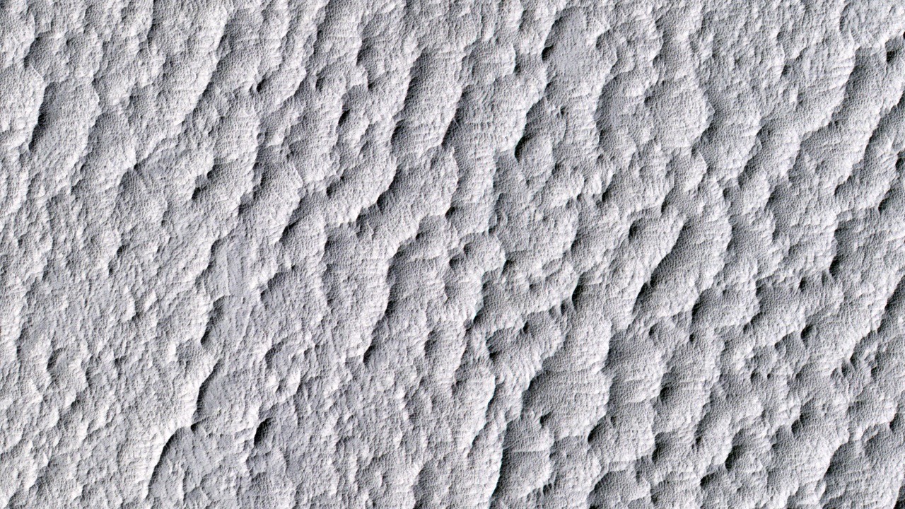 This July 2015 image from the HiRISE camera on NASA's Mars Reconnaissance Orbiter shows part of the southwest corner of Mars’ huge Schiaparelli Crater, the landing site for the Ares 4 mission in the novel and movie "The Martian."