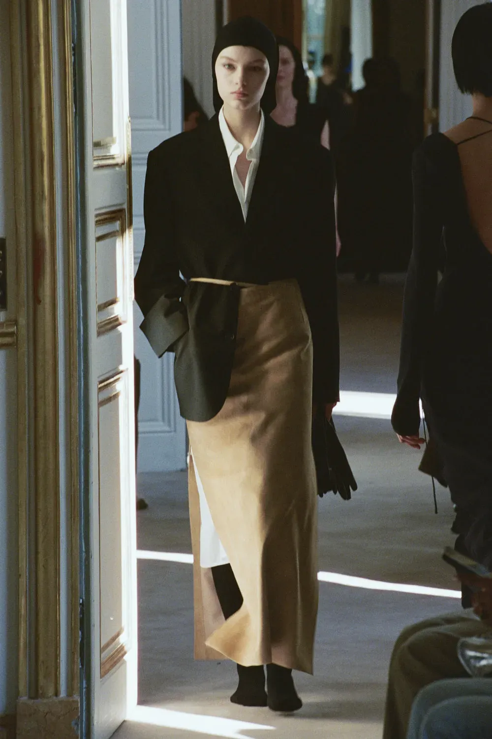 A model during the row resort 2026 show wears cashmere tights.