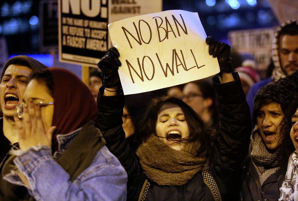 A woman protests President Trump&amp;#039;s immigration order