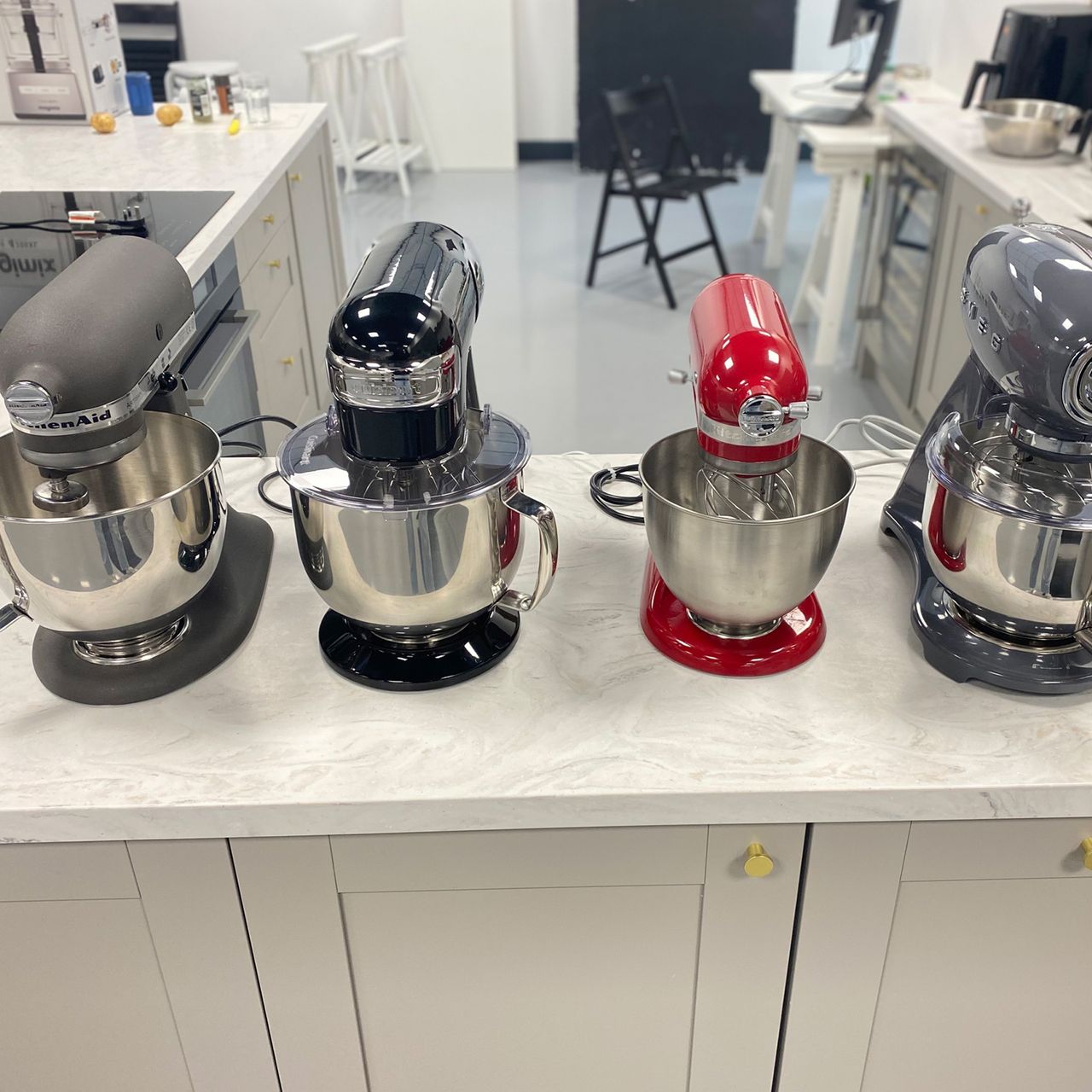 Image of testing process involving four stand mixers at test facility in Reading