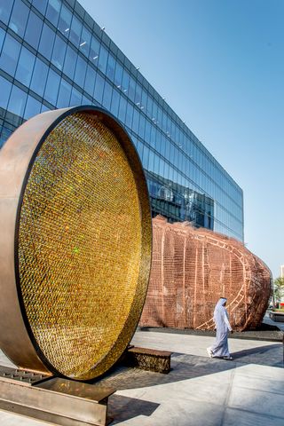 Prologue, a circular sculpture featuring over 8,000 amber crystal droplets attached to a steel frame