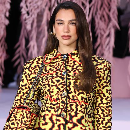 Dua Lipa attended Matthieu Blazy's debut Chanel couture show in a fiery skirt set from his M&eacute;tiers d'Art Spring 2026 collection 