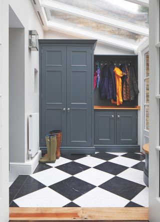 blue painted small boot room storage with check floor