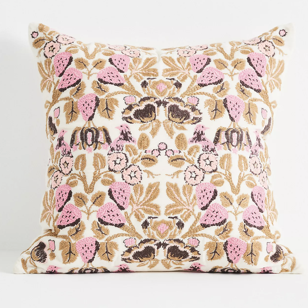 pink and brown patterned pillow