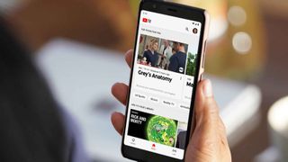 YouTube TV, showing Grey's Anatomy and Rick and Morty, on a phone