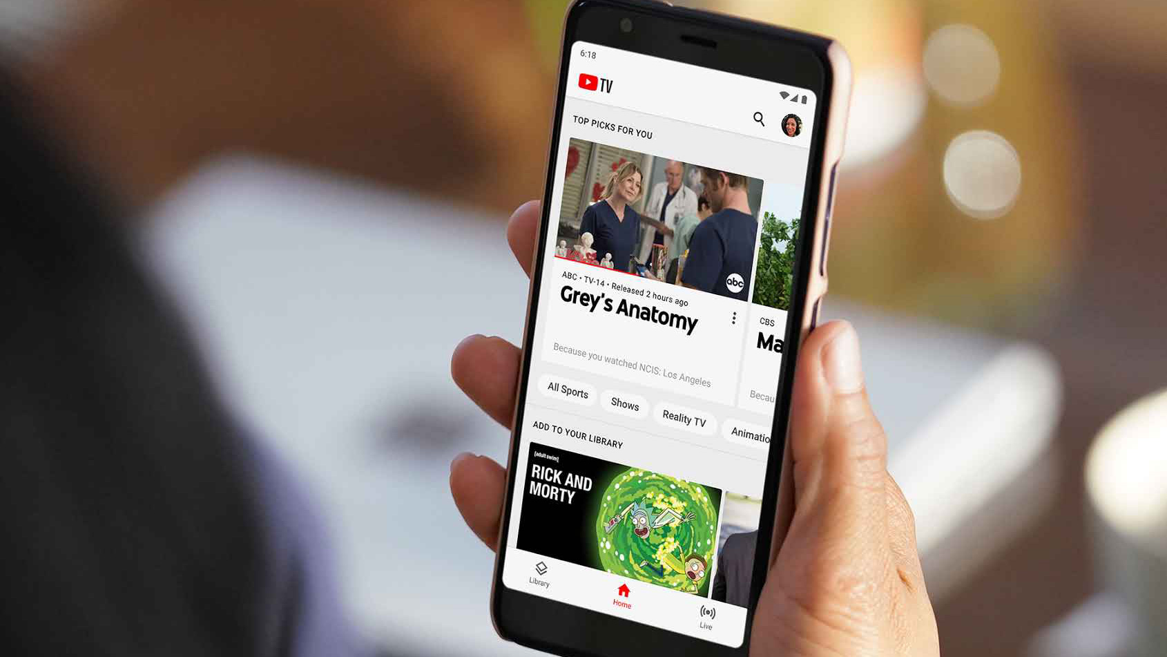 YouTube TV, showing Grey's Anatomy, Rick and Morty, on the phone