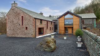 extended stone barn conversion with stone walling