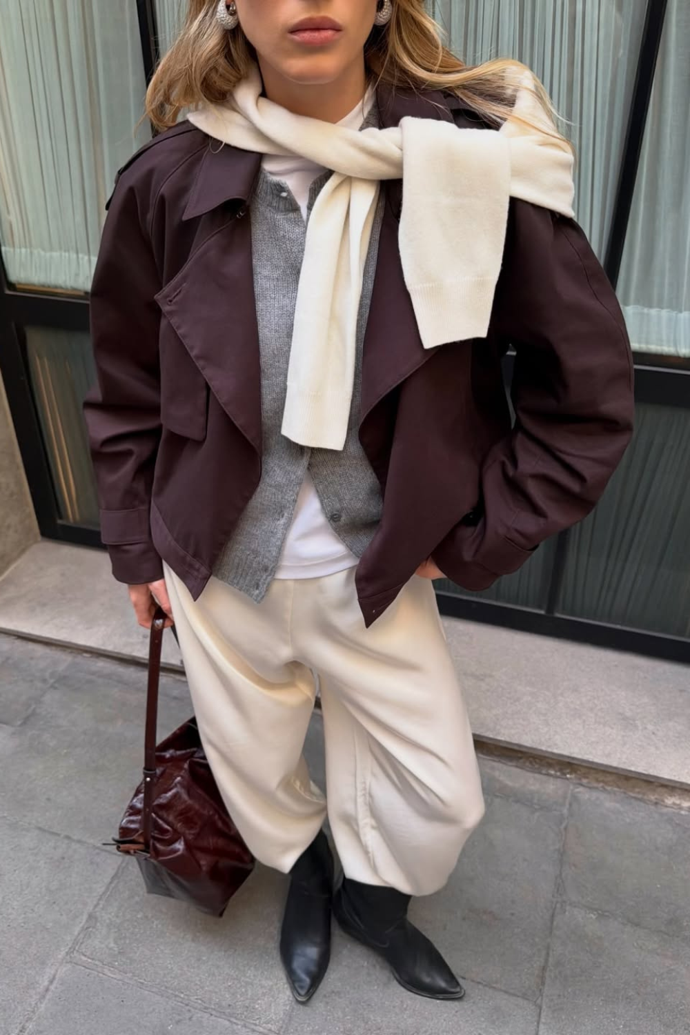 @tripplehorn wears cream satin trousers brown jacket