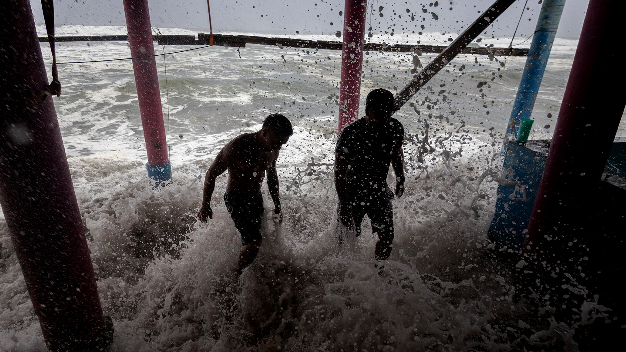 Residents in Playa Azul, Mexico used sandbags as a protective barrier against strong waves generated by Hurricane Polo.