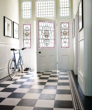 black and white checkerboard floor in hallway
