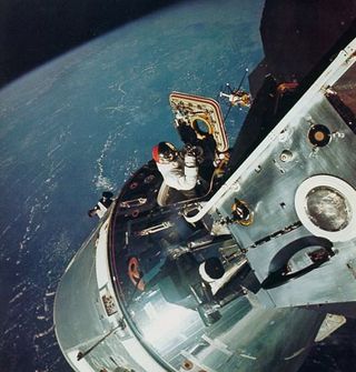 Apollo 9 astronaut Dave Scott coming out of the command and service module during a spacewalk in March 1969.