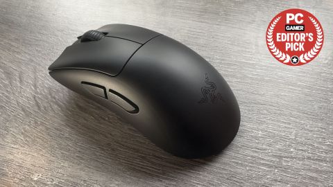 A photo of a Razer DeathAdder V3 HyperSpeed gaming mouse resting on an office desk, with a PCGamer Editor's Pick Award logo in the top right corner
