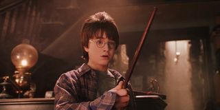Harry trying out his wand in Harry Potter and the Sorcerer's Stone