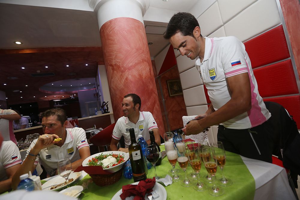 Alberto Contador pours the celebratory champagne for his team.