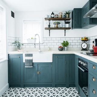 Blue kitchen with vinyl and white metro tiles