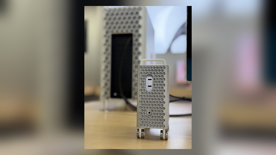 A M4 Mac Mini has been mounted inside of a 3D printed case, making the tiny hardware look like a shrunk down Mac Pro tower.