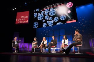 A panel of speakers presenting at the World Science Festival.