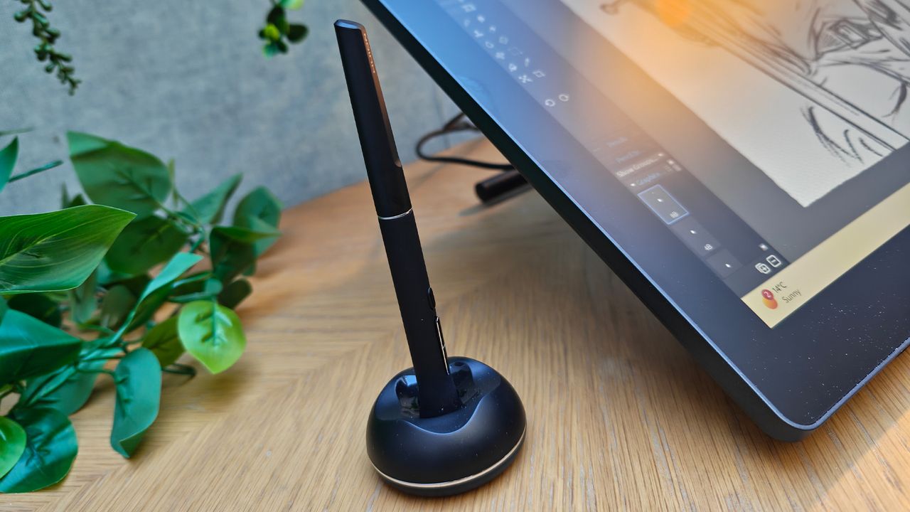 A black drawing tablet on a desk