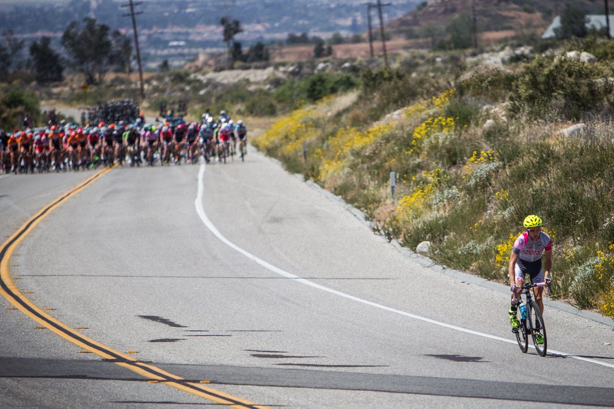 A solo rider tries to sneak away from the men