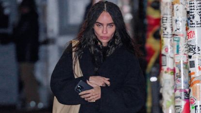 Zoë Kravitz's Outfit to Taylor Swift's Birthday Party included blue jeans, a navy jacket, red socks, and loafers