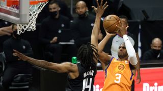 Chris Paul #3 of the Phoenix Suns goes up for a shot against Terance Mann #14 of the LA Clippers during the first half in Game Six of the Western Conference Finals at Staples Center on June 30, 2021 in Los Angeles, California.