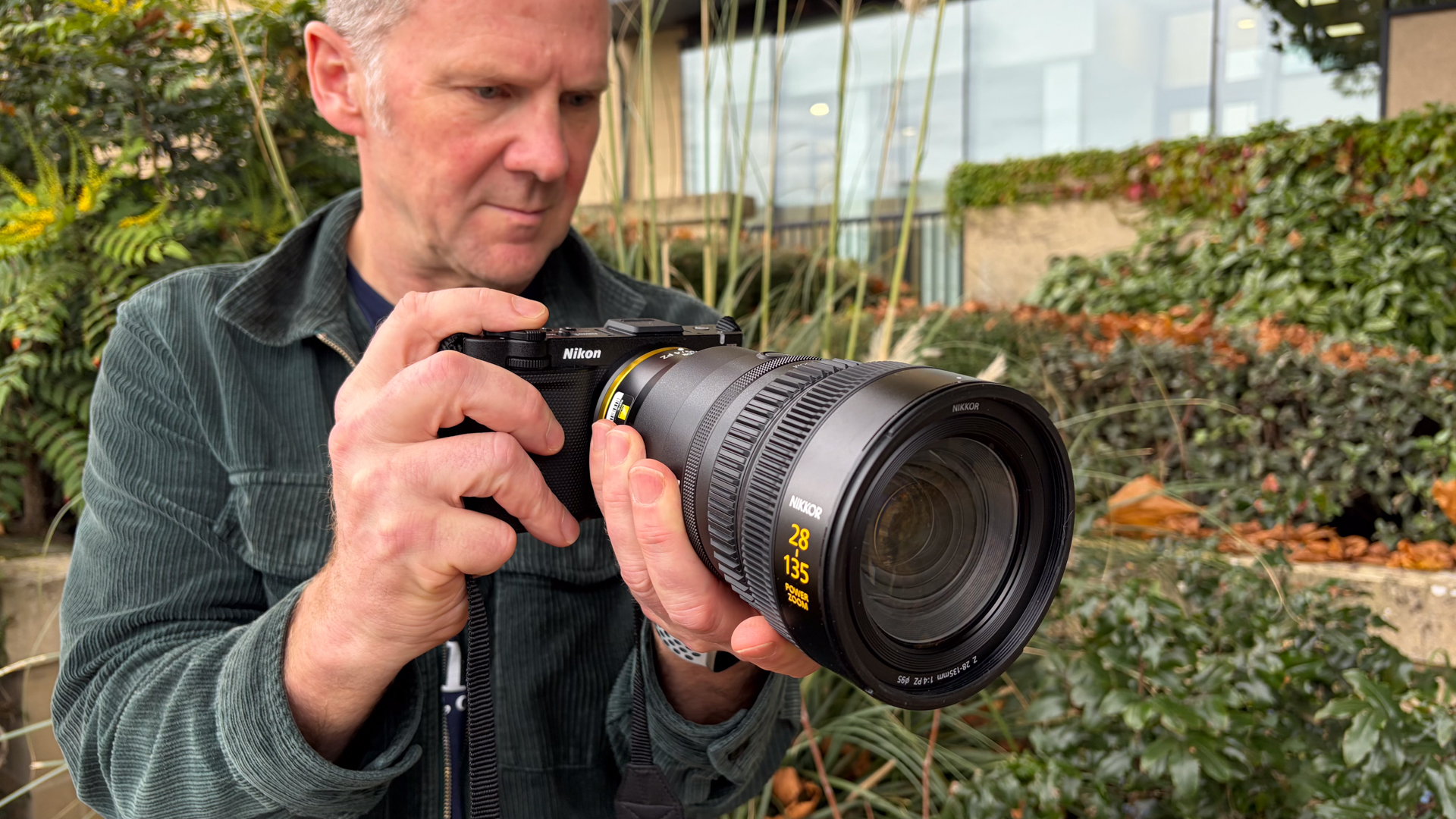 Person holding a Nikon ZR with Z 28-135mm f/4 PZ lens