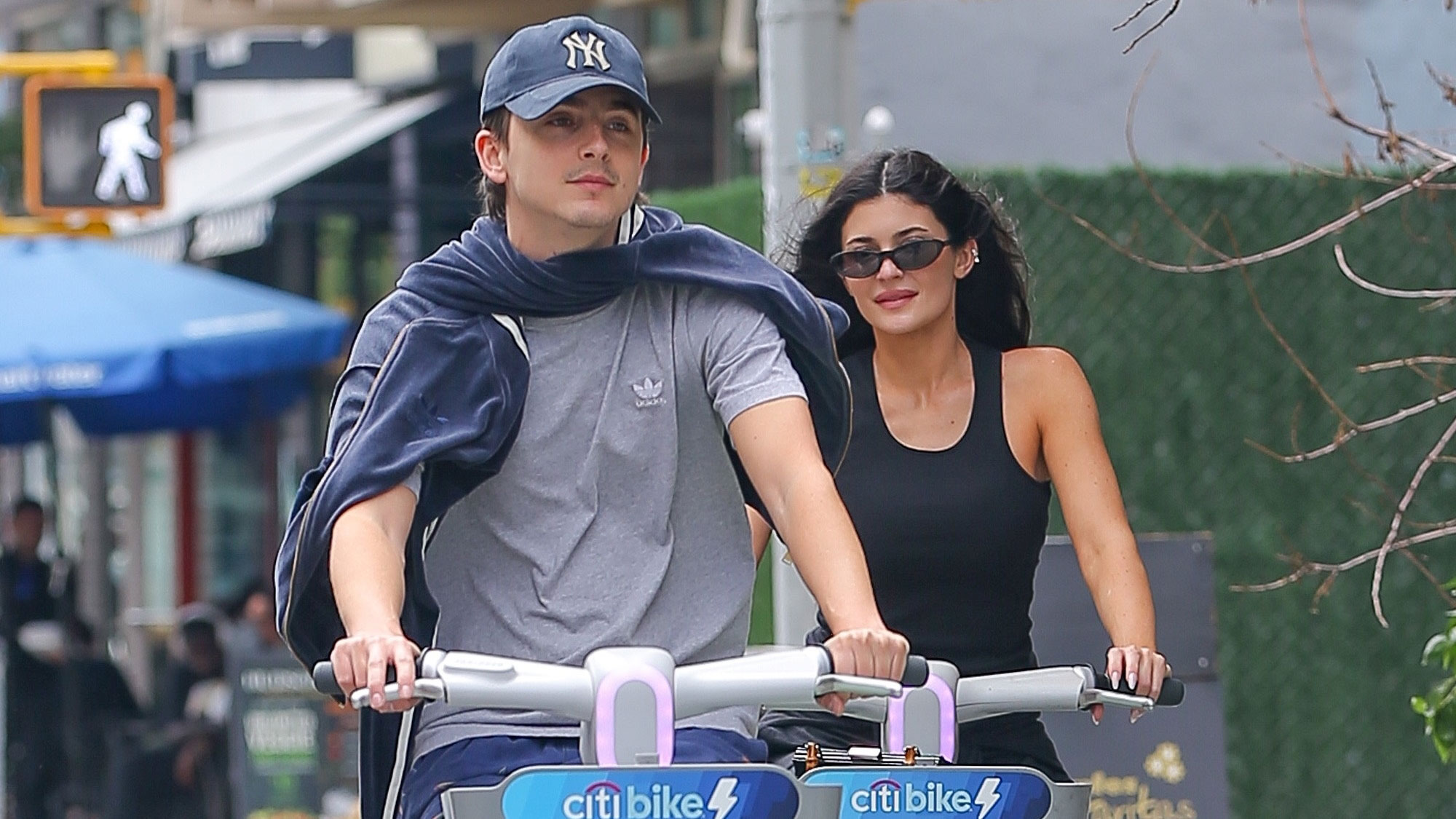 Kylie Jenner wears Maison Margiela Tabi Ballerina Flats on a Citi Bike with Timothee Chalamet