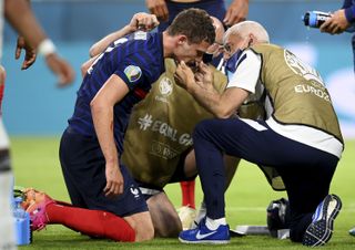 Pavard receives medical attention after his collision