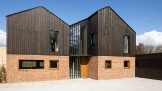 contemporary self build with timber cladding and modern brickwork