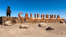 A sign welcoming people to California in the city of Needles.
