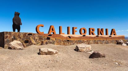 A sign welcoming people to California in the city of Needles.