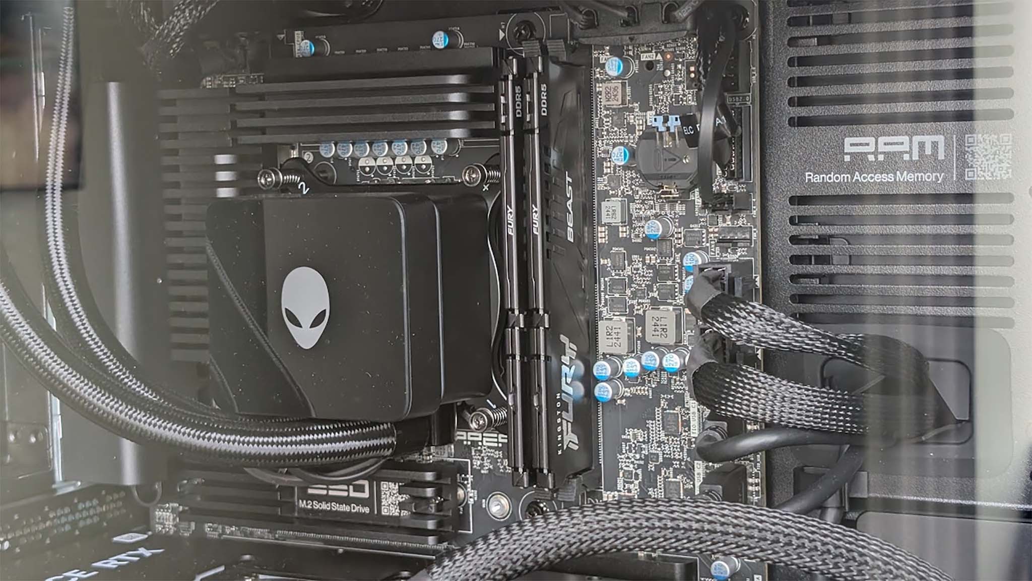 Original photo of Alienware Area-51 Gaming Desktop with distracting reflections and dust specks.