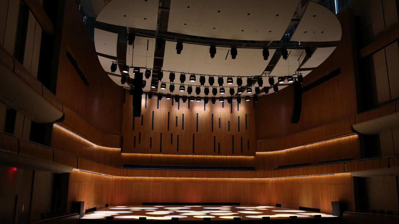 The Holland Center in Omaha alit in blue and red by Ayrton lighting solutions.