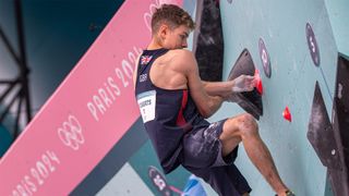 Great Britain&#039;s Toby Roberts on his way to a gold medal in the boulder and lead event at the Olympics sport climbing event.