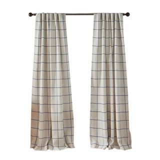 Two white curtain panels with a checked pattern on a black rod
